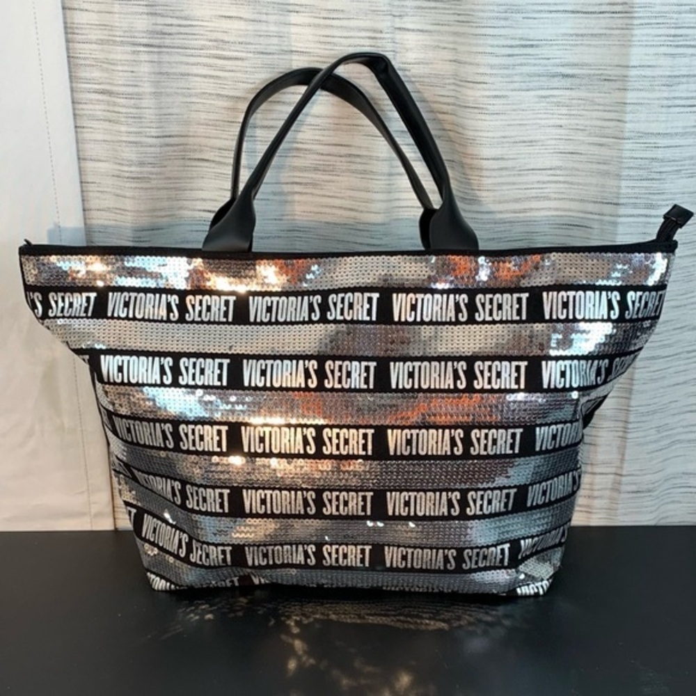 Victoria’s Secret black and silver large zippered tote bag.